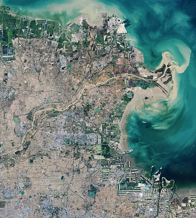 NASA Earth Observatory images by Lauren Dauphin, using Landsat data from the U.S. Geological Survey. Story by Adam Voiland on Wikimedia Commons
