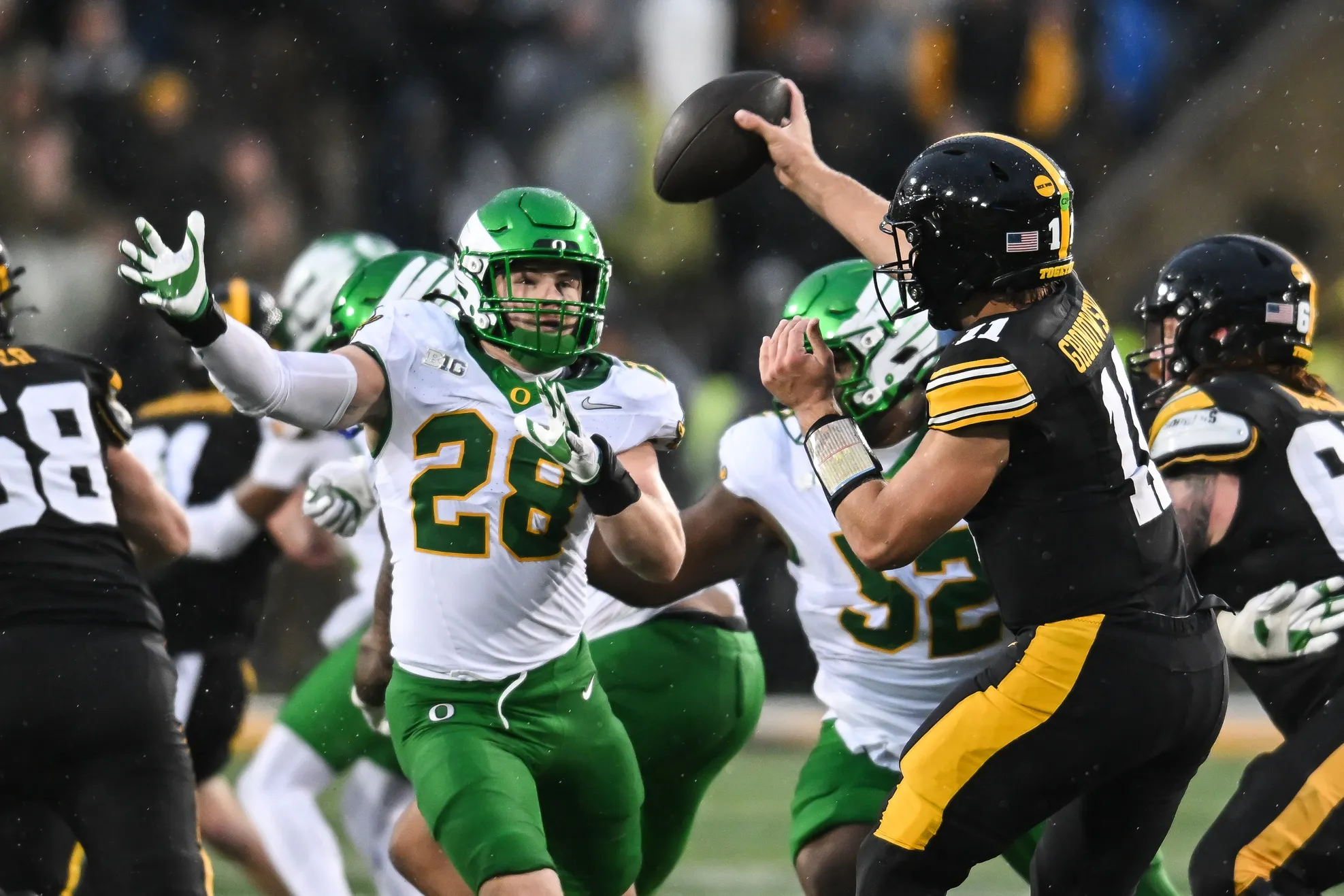 Oregon Survives Iowa in Rain-Soaked Battle of Grit