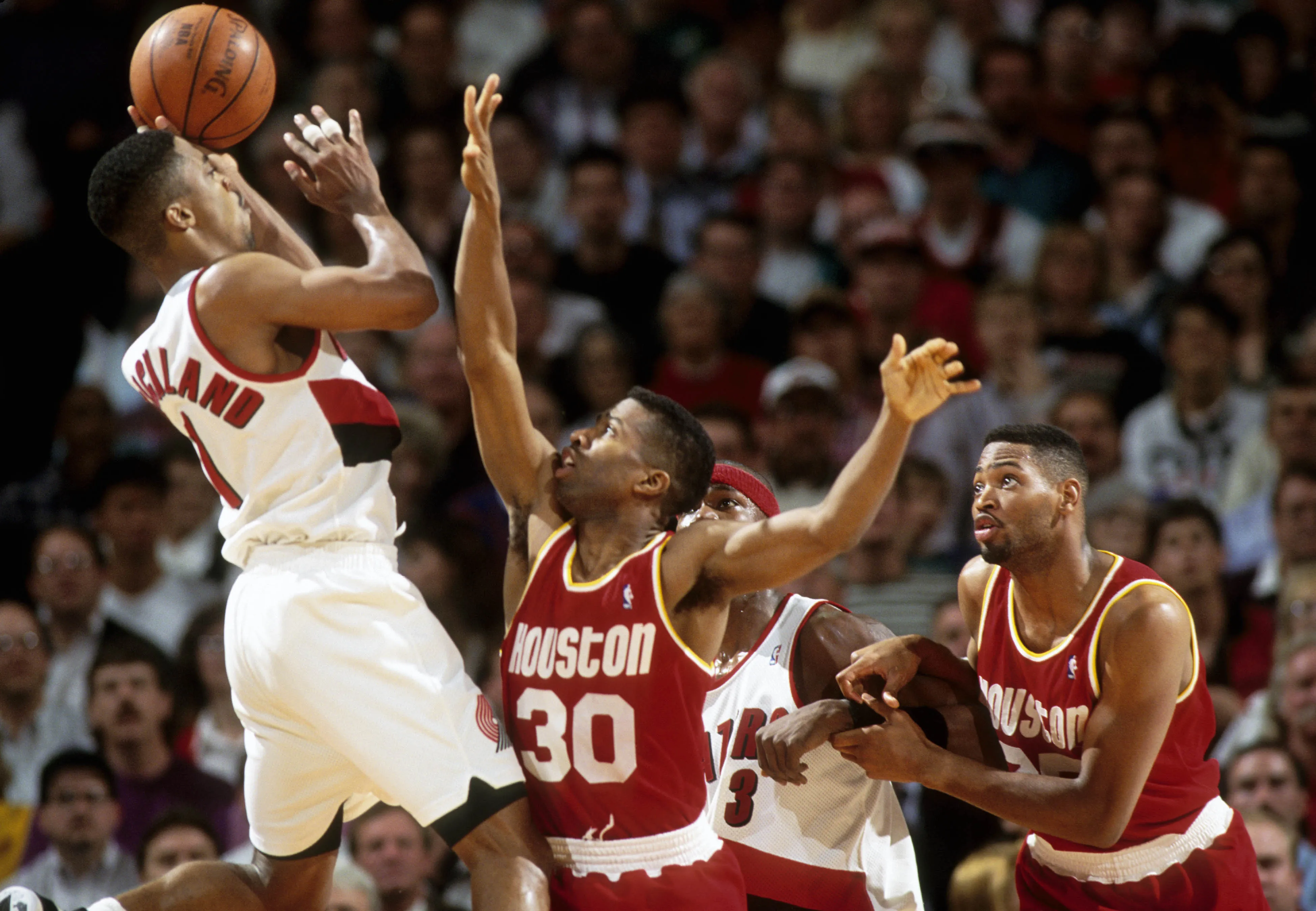 May 3, 1994; Portland, OR, USA: FILE PHOTO; Houston Rockets guard Kenny Smith (30) defends a shot by Portland Trail Blazers guard Rod Strickland (1) in the 1993-94 NBA Playoffs at Memorial Coliseum