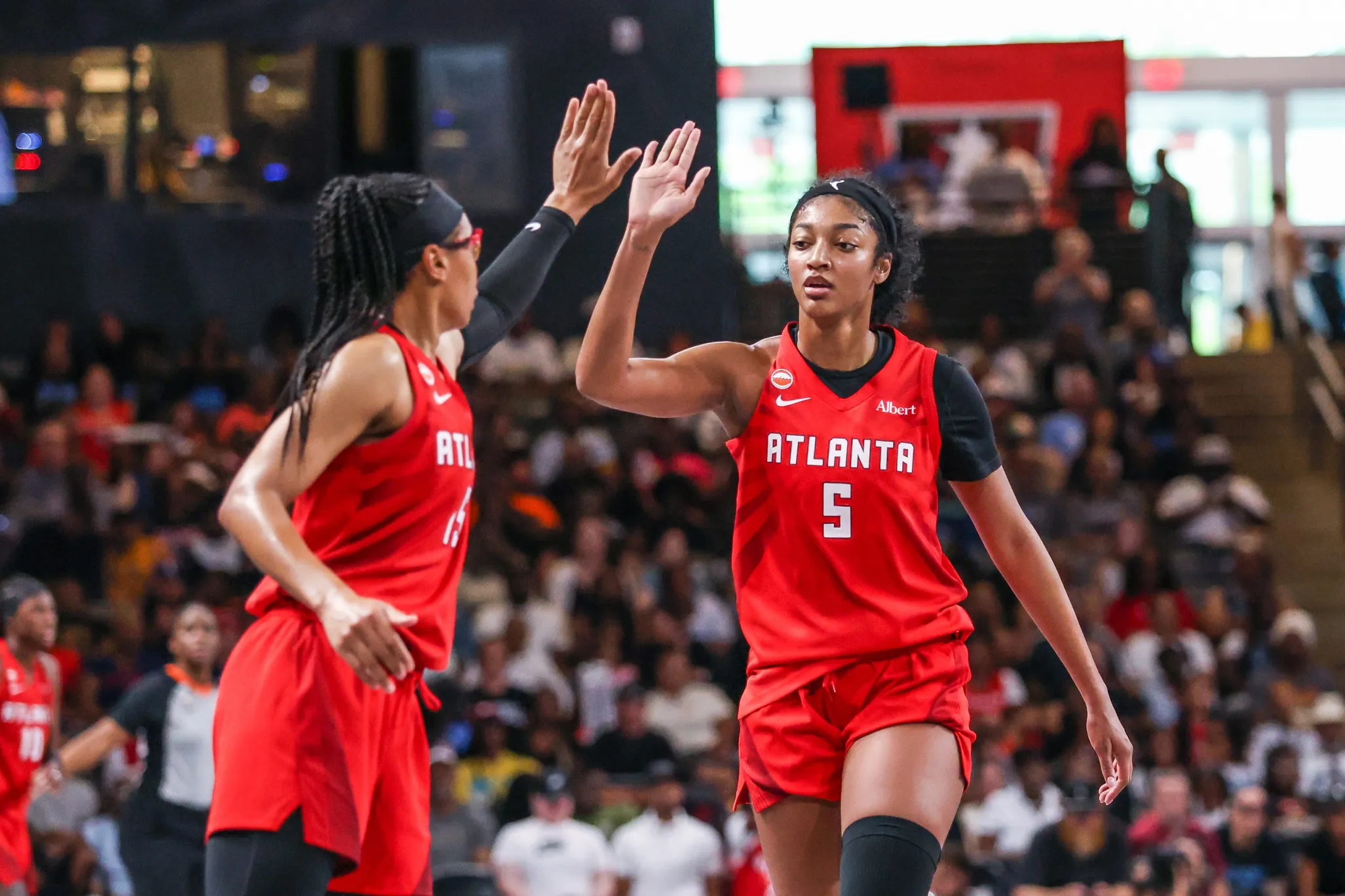 Angel Reese’s Courtside Photo With Julius Erving After Dream Win Sparks Debate