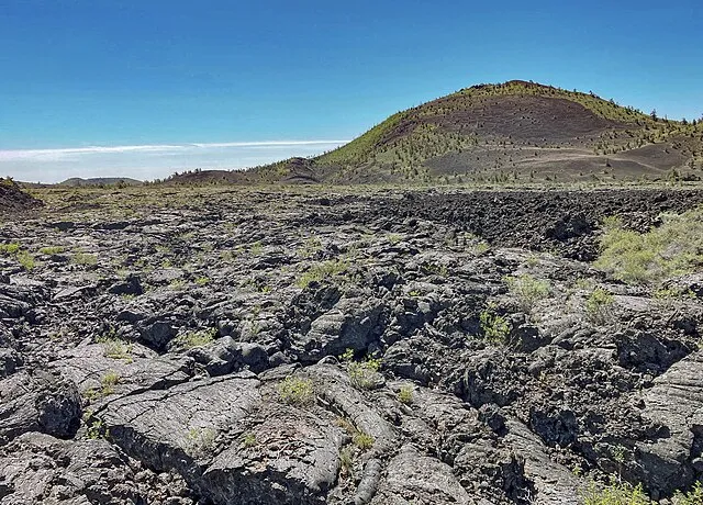 NASA Earth Observatory images by Michala Garrison, using Landsat data from the U.S. Geological Survey. Story and 2024 photo of Craters of the Moon lava and cinder cone by Lindsey Doermann on wikimedia