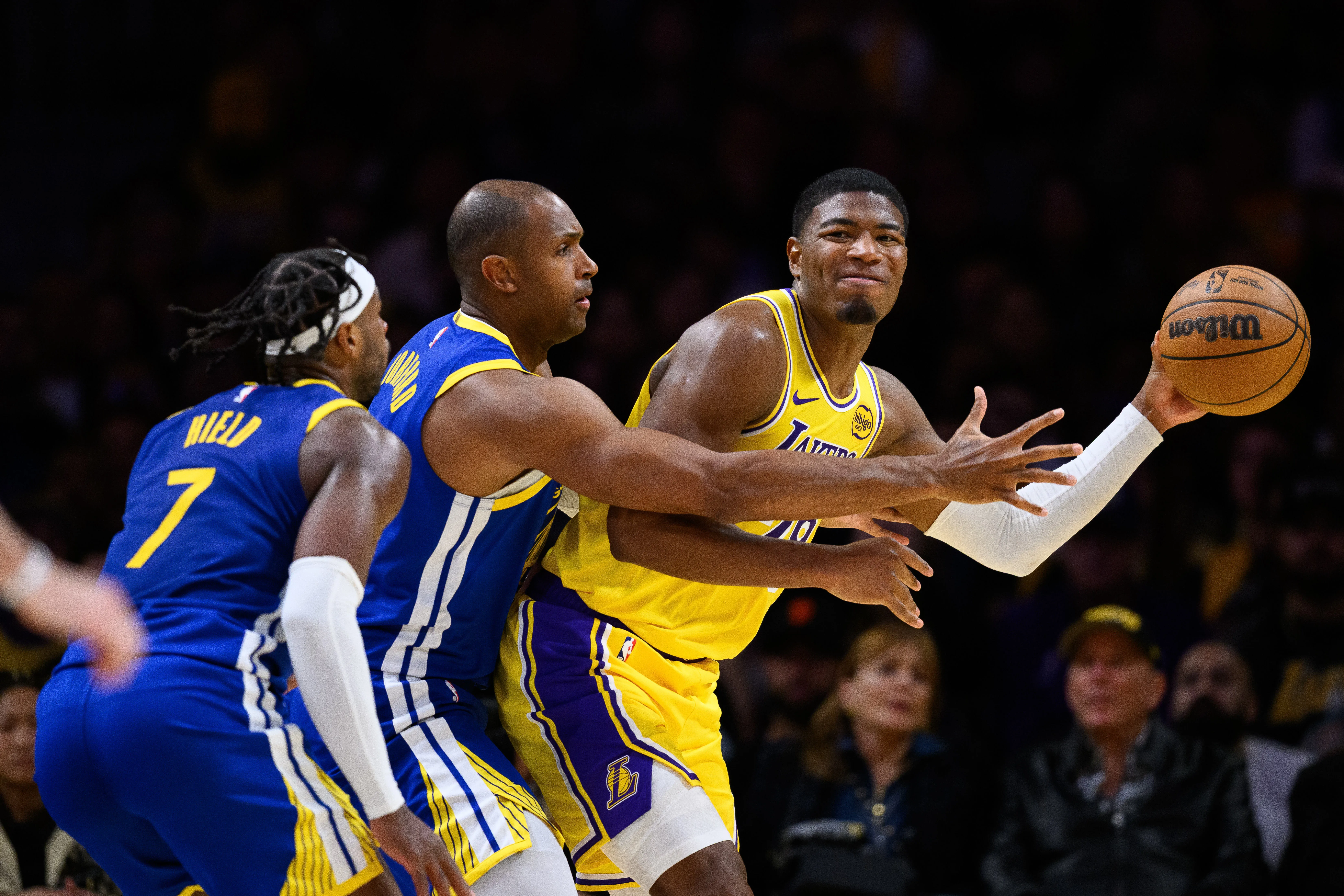 Oct 21, 2025; Los Angeles, California, USA; Los Angeles Lakers forward Rui Hachimura (28) passes against Golden State Warriors center Al Horford (20) and guard Buddy Hield (7) during the second half at Crypto.com Arena.