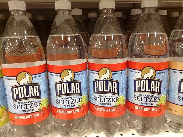 Clear glass bottle on a white surface on Wikimedia Commons 