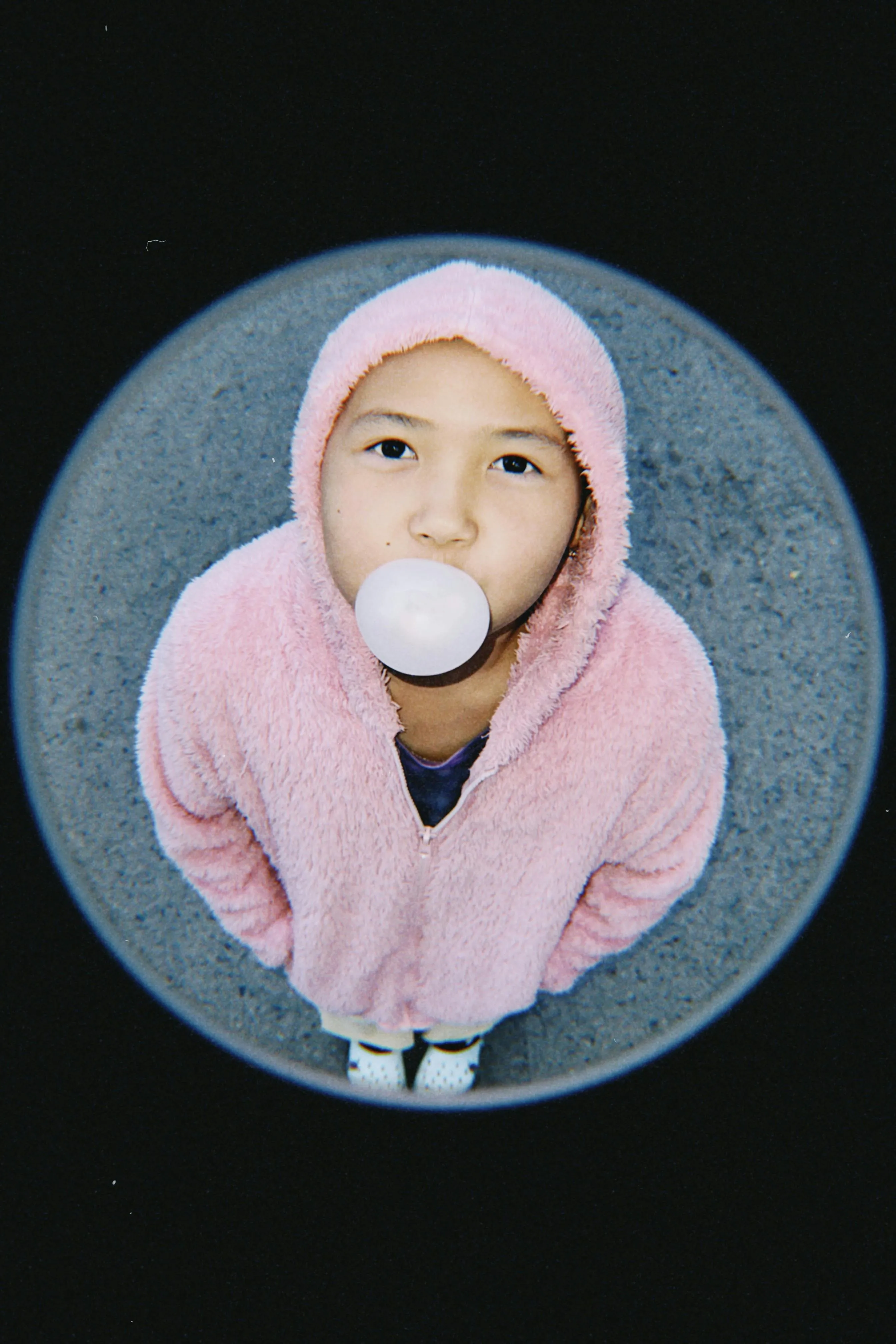 Child blowing a bubble with chewing gum on Pexels