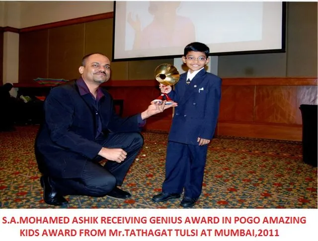 Mohamed Ashik Recieving POGO Amazing Kids Genius Award 2011